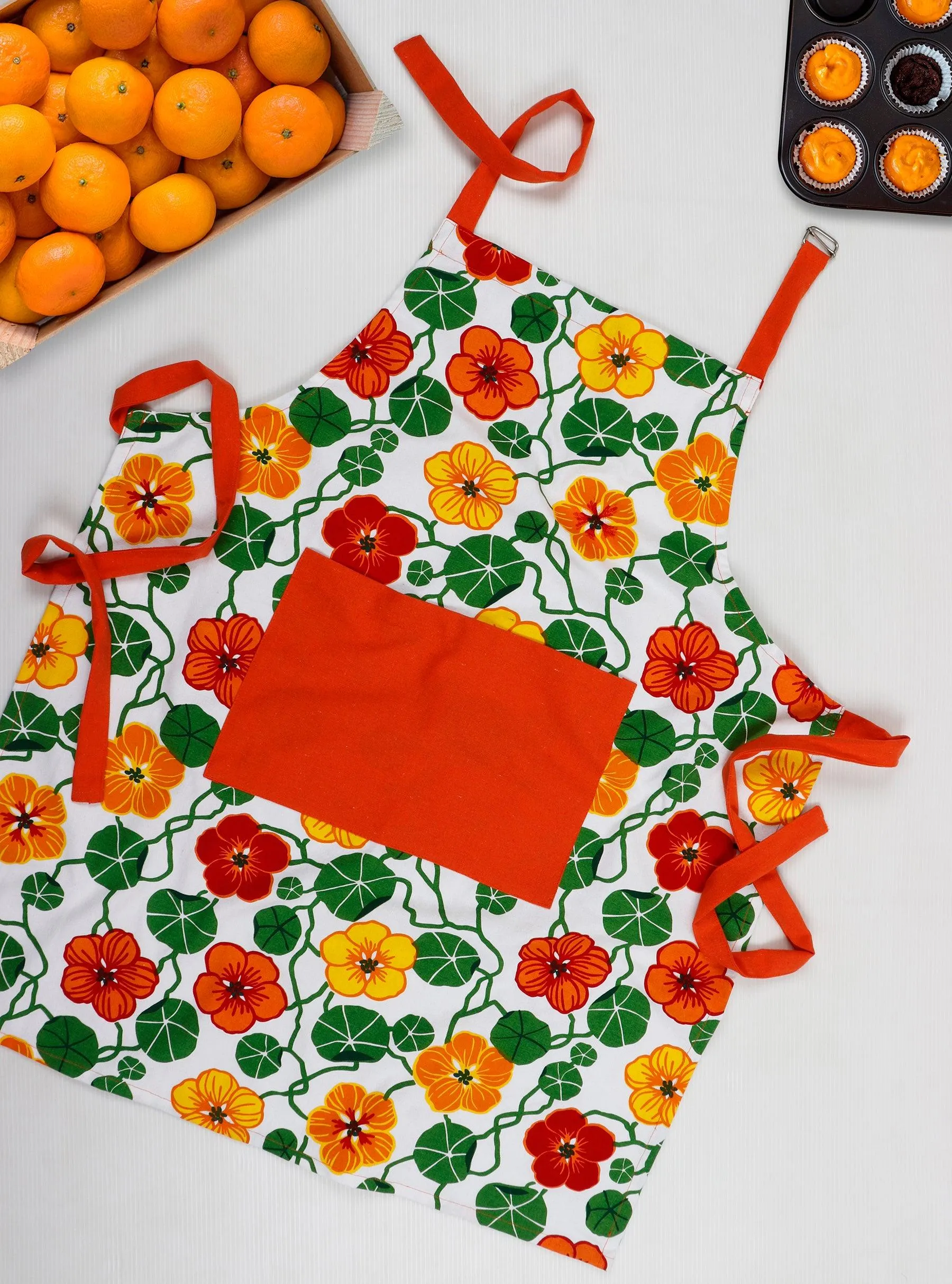 Cotton Green and Orange Flower With Orange Solid Pocket Free Size Apron Pack Of 1
